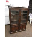 Mid century Ercol display cabinet with glazed doors to top and cupboard to base H138cm W101cm