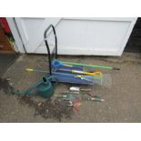 Garden tools including fork and shovel and metal folding trolley