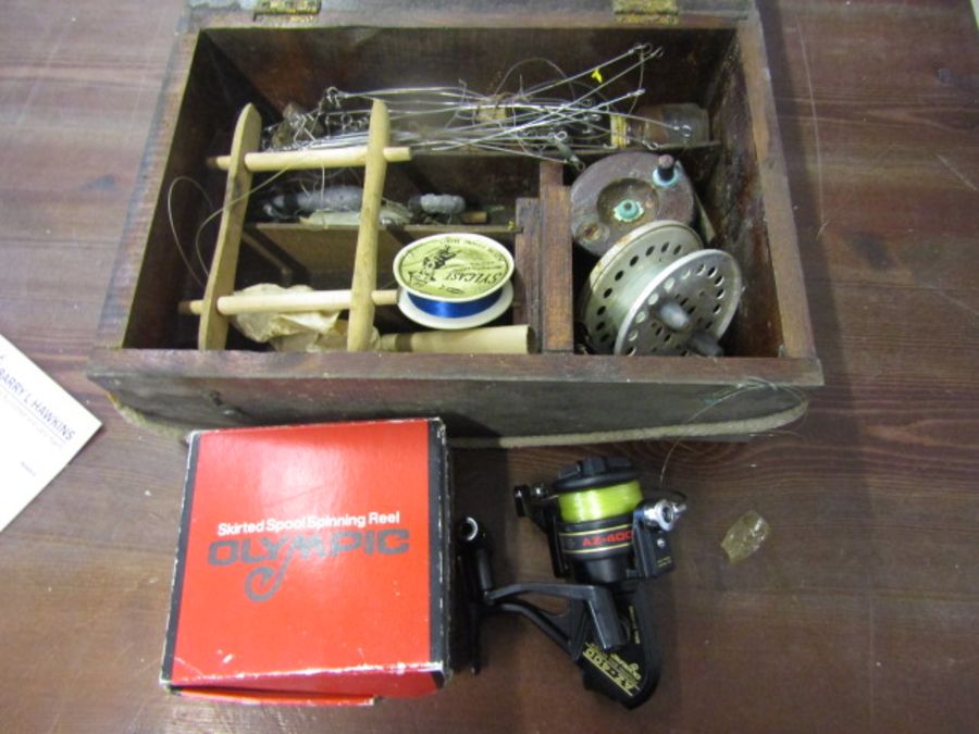 Olympic spinning reel, tackle box with contents a box of vintage reels, weights etc