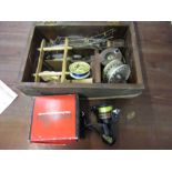 Olympic spinning reel, tackle box with contents a box of vintage reels, weights etc