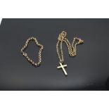 9ct gold crucifix pendant stamps 375 (4.1grams) on belcher link yellow metal chain stamped 375 (9.