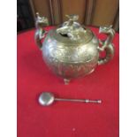 Asian style handled brass pot and tea strainer (small hole and dent to back of pot)
