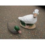 Concrete duck garden ornament and plastic duck