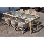 Glass topped 7' 6" wicker conservatory table with 6 chairs