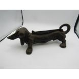 Cast iron sausage dog door stop