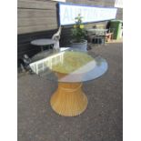 Bamboo dining table with glass top. Diameter of top is 99cm approx