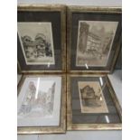 4 prints of buildings in matching frames