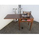Electric Singer sewing machine with table