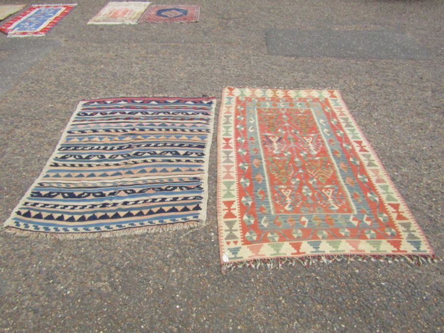 2 Rugs. Largest 135cm x 230cm approx