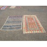 2 Rugs. Largest 135cm x 230cm approx