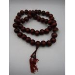 Oka decorative beads in maroon