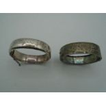 Two silver engraved hallmarked hinged bangles - one marked Birmingham 1964 by RPH Jewellery co ltd