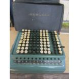 A vintage Comptometer with cover