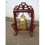 Brass bell in wooden stand H45cm approx