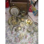 A collection of brass items all in a large brass box