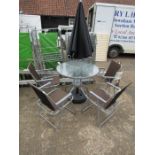 Garden table with 4 folding chairs, parasol and parasol base