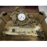 An antique gilt and marble clock depicting cherubs - needs attention
