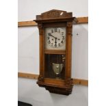 Oak framed wall clock with key