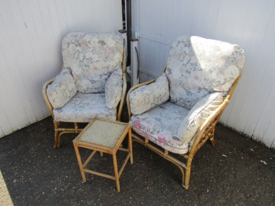 Pair of upholstered wicker conservatory chairs in need of re-upholstering with side table