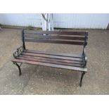 Garden bench with cast iron ends and wooden slats