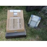 NCR electronic cash register and vintage Roto Stamp shop stamp dispenser, both for display