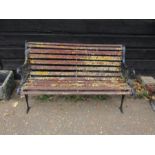 Garden bench with cast iron ends and wooden slats