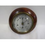 A wooden cased small round barometer