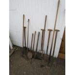 Mixed garden hand tools including shovels and forks