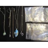 A collection of 9 silver necklaces