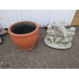 Terracotta garden pot and pig ornament