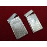 Two silver hallmarked card cases, one with an engraved ivy pattern 1908-09 Birmingham by maker JC or