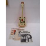 Beatles toy guitar with some sheet music inc Beatles Lady Madonna