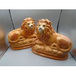 Pair of Staffordshire Style Pottery Lions with Glass Eyes