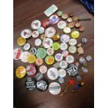 A collection of vintage badges including 1940s