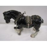 A large ceramic shire horse- leg repaired