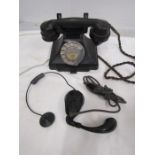A vintage tepephone and switchboard earpiece