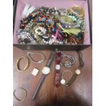 A shoebox of costume jewellery and watches