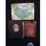 Vintage albums of cigarette cards and tin of cigarette cards