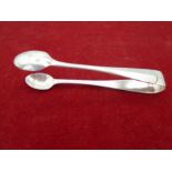 A Pair of Silver hallmarked sugar tongs Sheffield 1935 by Walker & Hall - gross weight 35g.