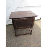 Small oak works cupboard with drop down door and hinged lid poss sewing machine table?