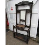 Antique oak carved hall stand with mirror, drawer and drip trays