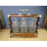 Oak tantalus with 3 decanters and key