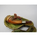 Cheroot holder with carved dog in case