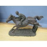 A resin horse and jockey figure 34cm long