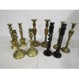 4 pairs brass candlesticks and 1 wooden pair