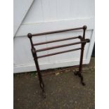 A mahogany towel rail