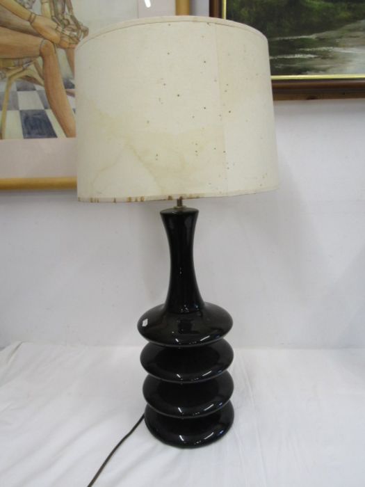 A tall black table lamp