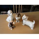 4 Dog figurines