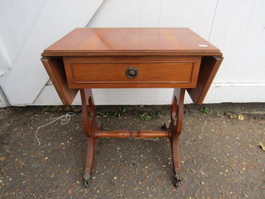 A small table with fold out leaves