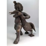 A Bronze figure of a cherub with a swan, freestanding 18" high